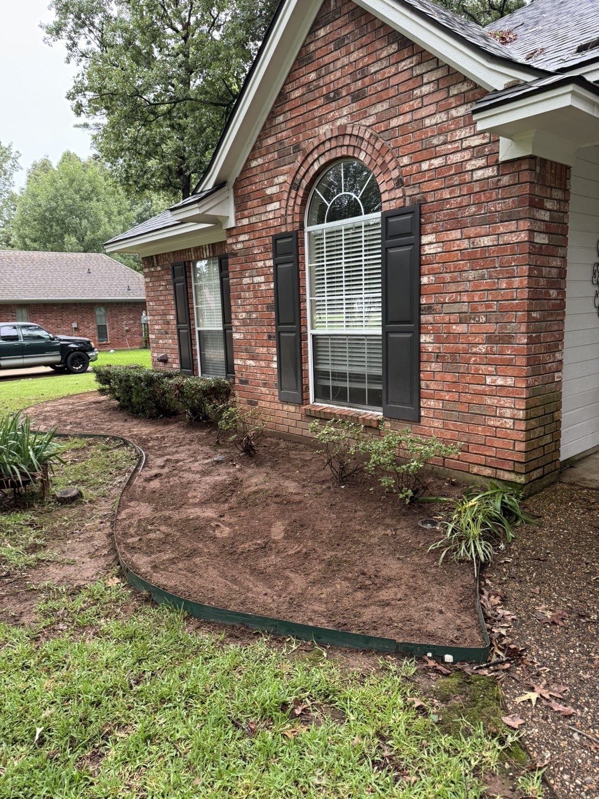Front yard cleanup and fresh mulch beds after